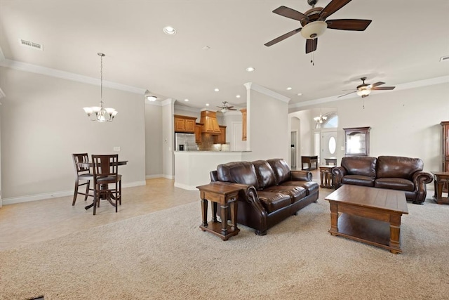 living room with visible vents, light carpet, ceiling fan with notable chandelier, arched walkways, and light tile patterned floors