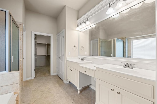 full bath featuring a sink, a shower stall, tile patterned flooring, double vanity, and a bath