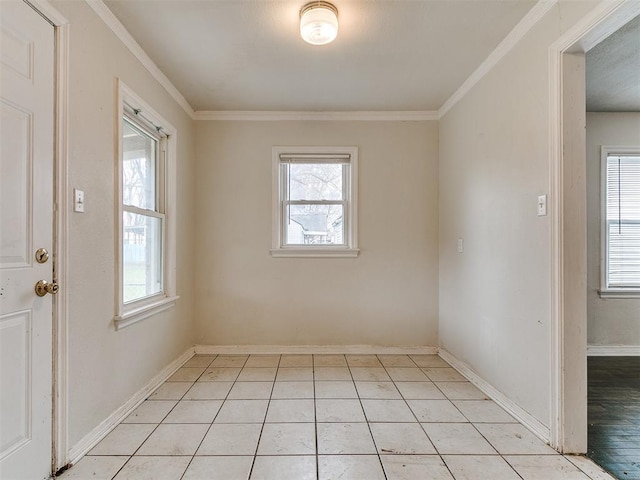 3216 NW 30th St, Oklahoma City, OK 73112 - empty room featuring healthy amount of natural light, ornamental molding, light tile patterned floors, and baseboards