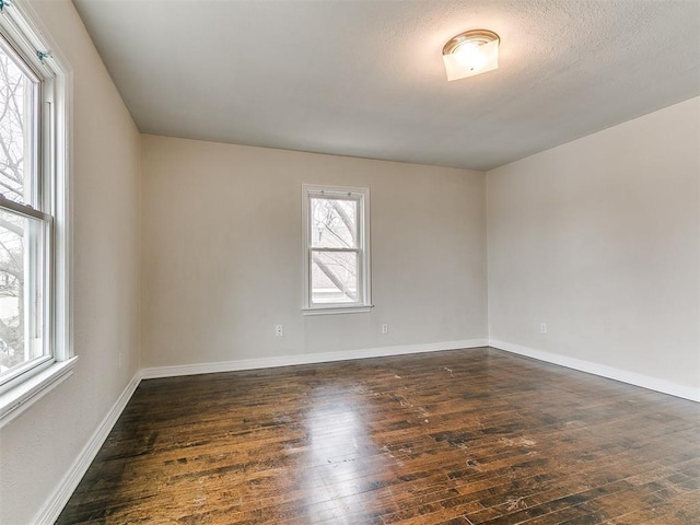 3216 NW 30th St, Oklahoma City, OK 73112 - empty room with dark wood-style floors and baseboards