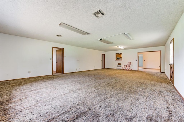 4801 Del Crest Dr, Del City, OK 73115 - spare room with a textured ceiling and carpet flooring