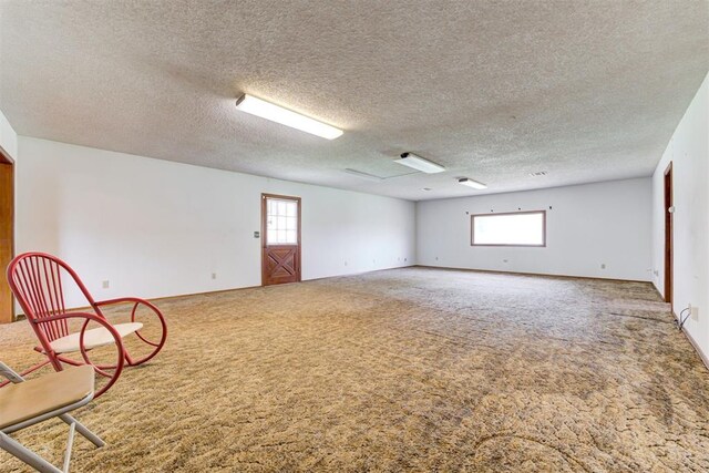 4801 Del Crest Dr, Del City, OK 73115 - spare room featuring carpet flooring and a textured ceiling