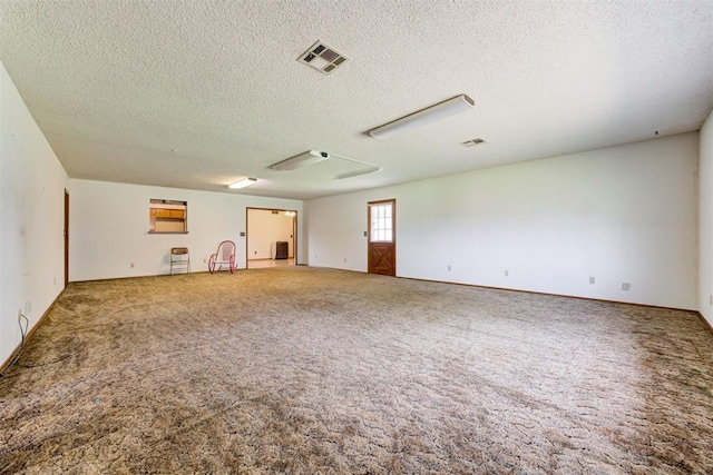 4801 Del Crest Dr, Del City, OK 73115 - carpeted spare room featuring a textured ceiling