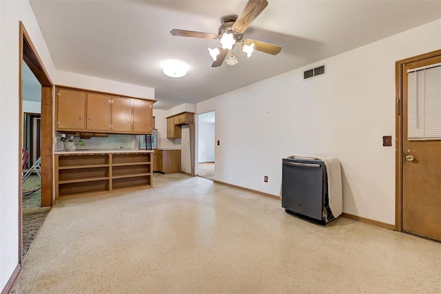 4801 Del Crest Dr, Del City, OK 73115 - kitchen featuring a ceiling fan, brown cabinets, light countertops, and open shelves