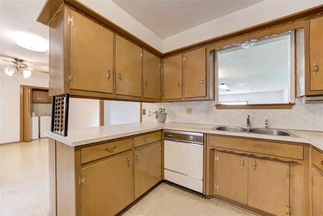 4801 Del Crest Dr, Del City, OK 73115 - kitchen featuring dishwasher, light countertops, a peninsula, washing machine and dryer, and light flooring