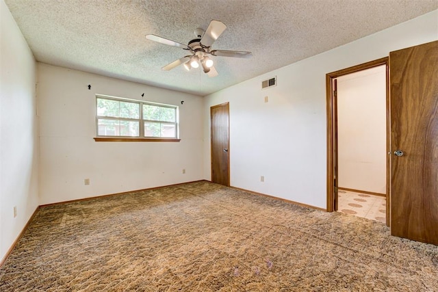 4801 Del Crest Dr, Del City, OK 73115 - carpeted spare room with ceiling fan and a textured ceiling