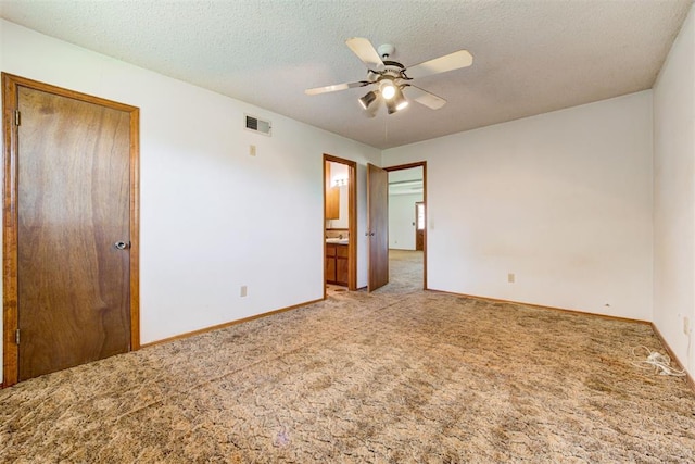 4801 Del Crest Dr, Del City, OK 73115 - unfurnished bedroom with carpet, a closet, ceiling fan, a textured ceiling, and ensuite bath