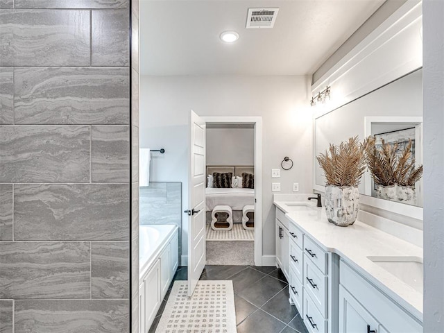 ensuite bathroom featuring visible vents, ensuite bath, double vanity, tile patterned flooring, and a bath