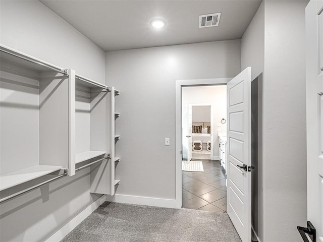 walk in closet with carpet and visible vents