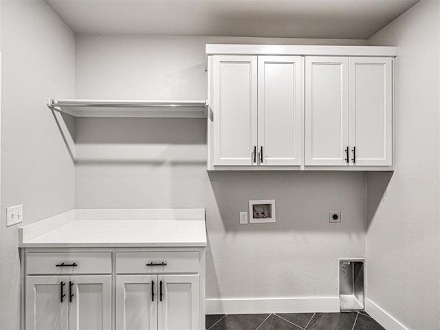 clothes washing area featuring washer hookup, cabinet space, baseboards, and hookup for an electric dryer