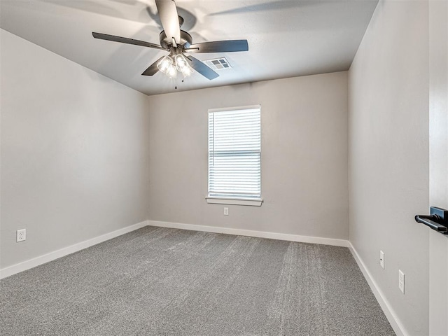 unfurnished room with visible vents, baseboards, carpet, and a ceiling fan