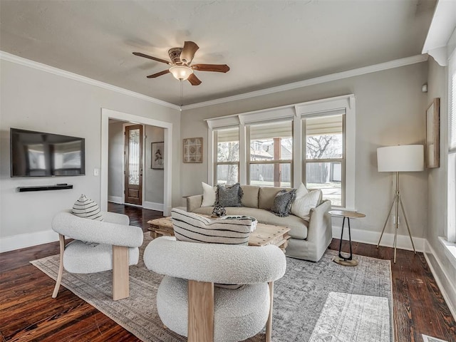 living area featuring dark wood-style floors, baseboards, a ceiling fan, and ornamental molding