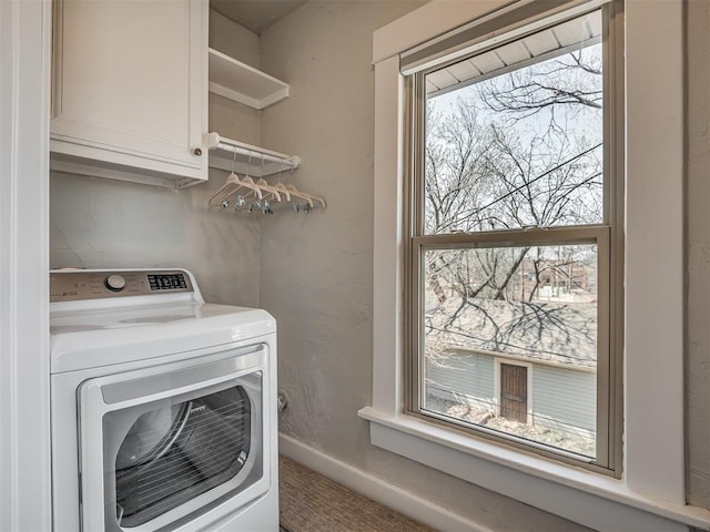 laundry area with cabinet space, washer / clothes dryer, and baseboards