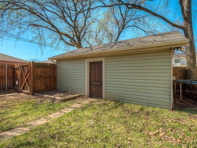 view of outbuilding with an outbuilding and fence