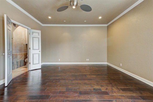 empty room with wood finished floors, crown molding, a ceiling fan, and baseboards