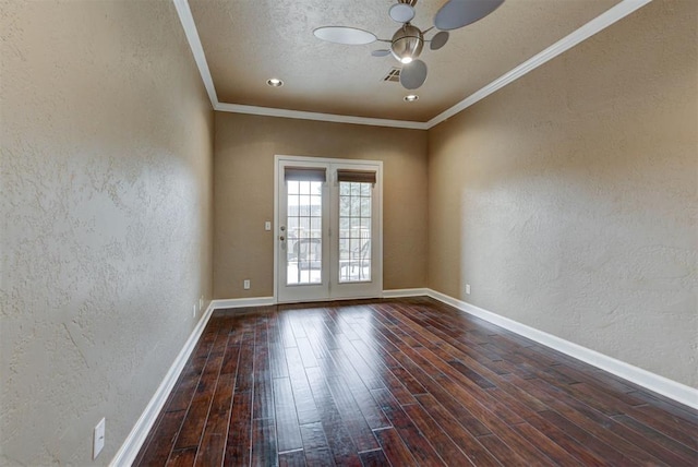 spare room featuring baseboards, a textured wall, ornamental molding, wood finished floors, and a ceiling fan