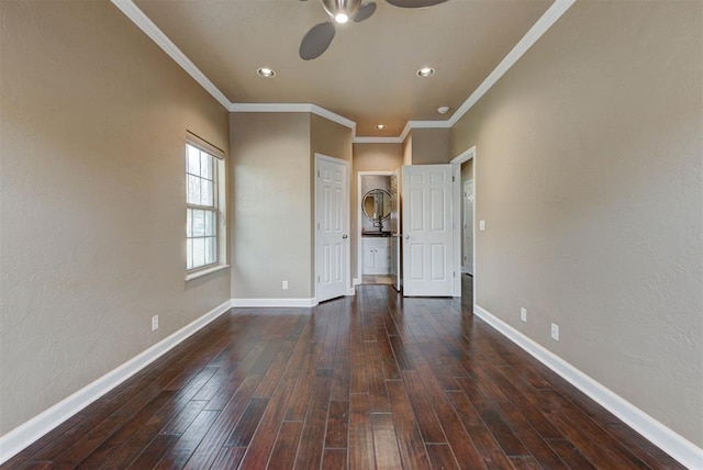 empty room with a ceiling fan, baseboards, recessed lighting, dark wood-type flooring, and crown molding