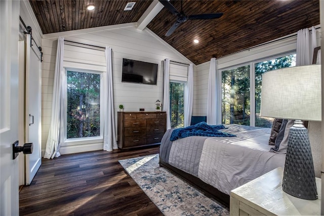 bedroom with wooden walls, dark wood-style floors, lofted ceiling with beams, a barn door, and wooden ceiling