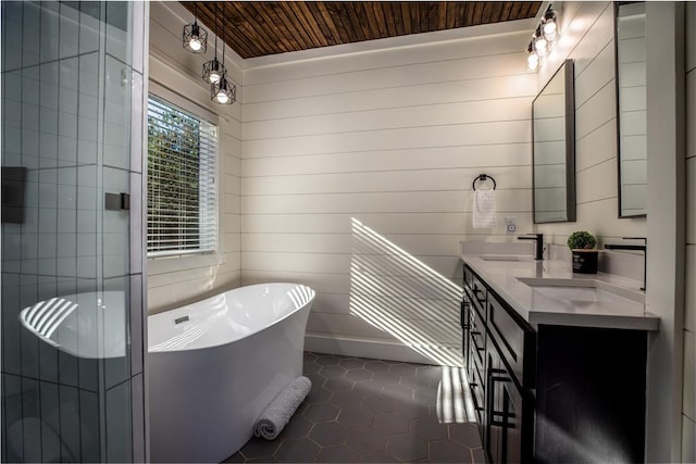 full bathroom featuring tile patterned floors, a soaking tub, wood ceiling, and a sink