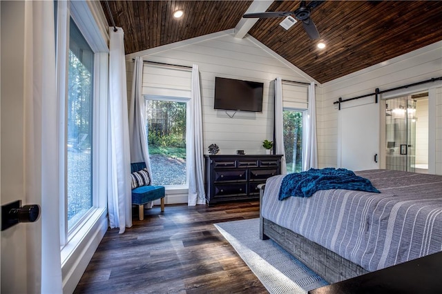 bedroom featuring lofted ceiling with beams, dark wood-style flooring, wood ceiling, wood walls, and a barn door