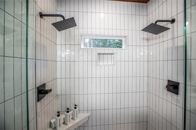 full bath featuring a tile shower