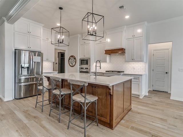 8800 Stark St, Arcadia, OK 73007 - kitchen featuring stainless steel appliances, a sink, crown molding, tasteful backsplash, and light countertops