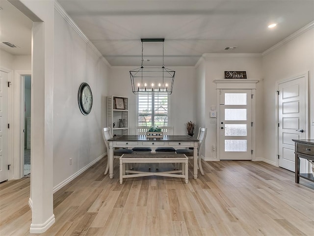 8800 Stark St, Arcadia, OK 73007 - dining space featuring a chandelier, light wood finished floors, ornamental molding, and baseboards