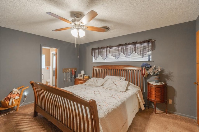 bedroom with carpet flooring, baseboards, and a textured ceiling