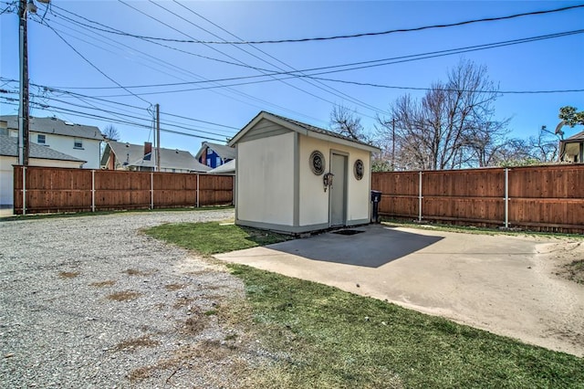 view of shed with a fenced backyard