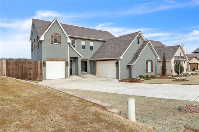 traditional home featuring driveway, fence, a shingled roof, a garage, and brick siding