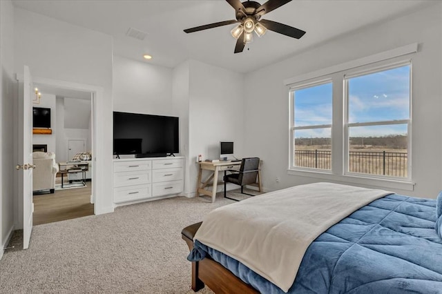 bedroom featuring carpet, visible vents, a ceiling fan, a fireplace, and recessed lighting