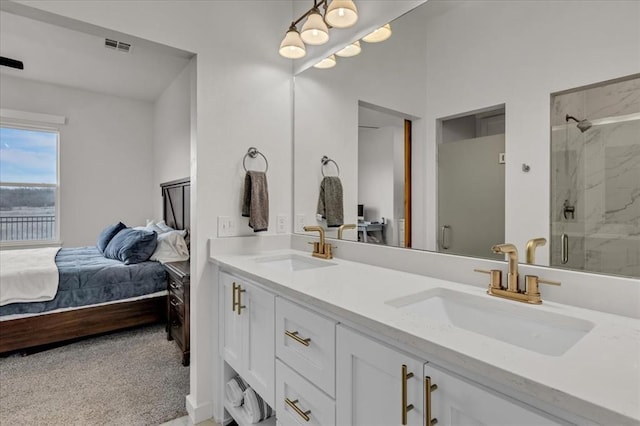 bathroom with a sink, connected bathroom, and a shower stall