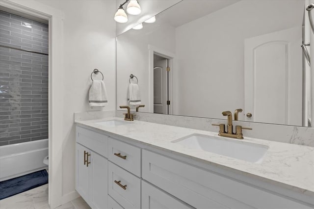 full bathroom with a sink, toilet, marble finish floor, and double vanity