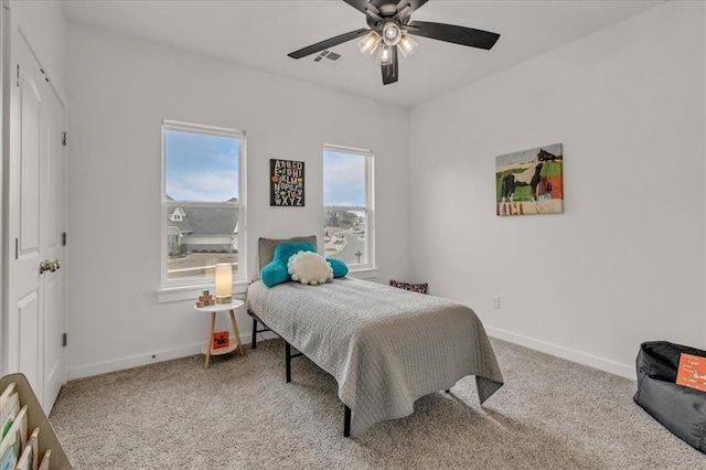 bedroom featuring visible vents, carpet floors, and baseboards