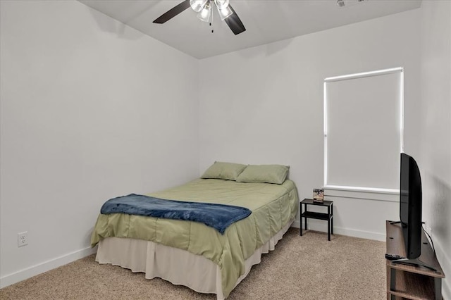 bedroom featuring visible vents, baseboards, carpet, and a ceiling fan