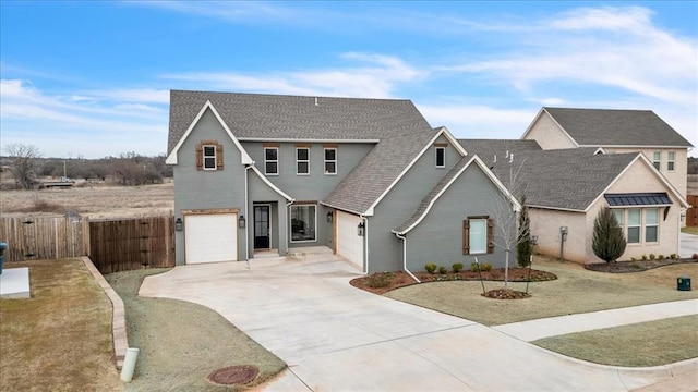 traditional-style home with driveway, a gate, fence, roof with shingles, and a garage