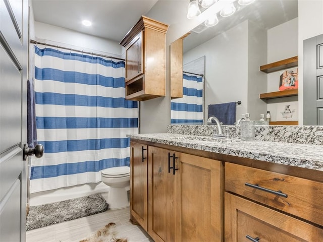 full bath with vanity, toilet, and a shower with shower curtain