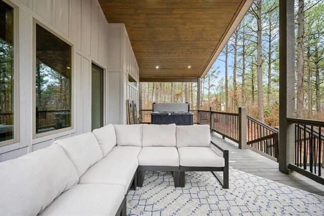 wooden terrace featuring an outdoor living space