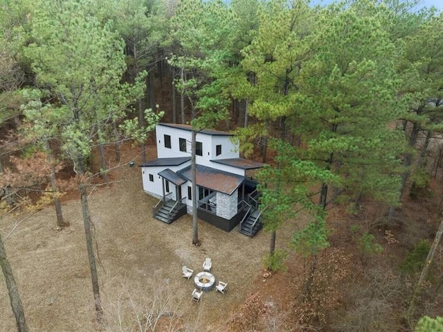 aerial view featuring a wooded view