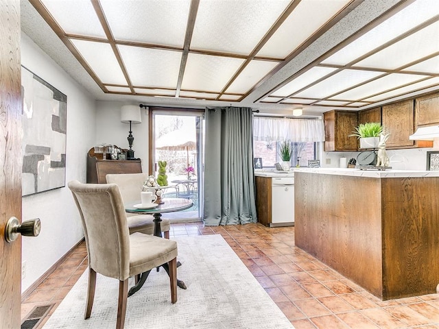 kitchen with light tile patterned floors, visible vents, dishwasher, and a healthy amount of sunlight