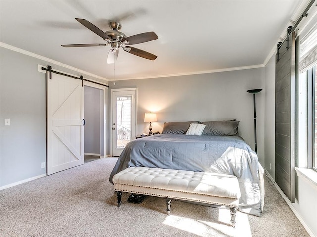 carpeted bedroom with a barn door, baseboards, access to exterior, and ornamental molding