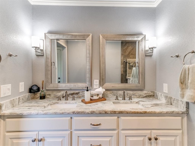 bathroom with a sink and double vanity