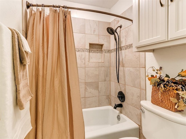 bathroom featuring toilet and shower / bathtub combination with curtain