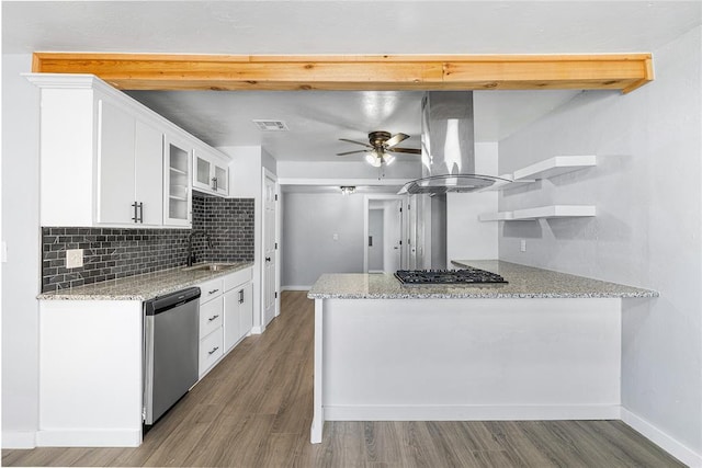 kitchen featuring a peninsula, open shelves, a sink, dishwasher, and island range hood