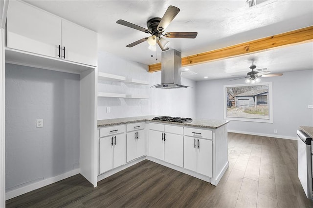 kitchen featuring stainless steel gas cooktop, a peninsula, island exhaust hood, ceiling fan, and dark wood-type flooring