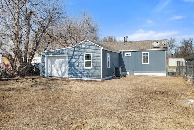 back of property with central AC unit and fence