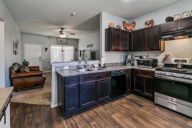 kitchen with ceiling fan, under cabinet range hood, appliances with stainless steel finishes, a peninsula, and a sink