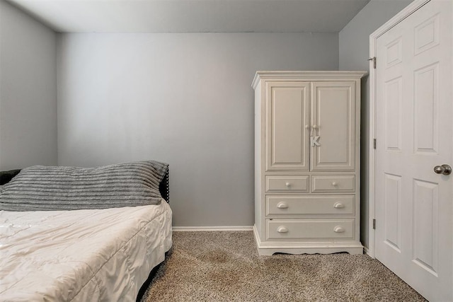 carpeted bedroom with baseboards