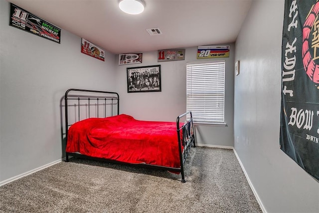 bedroom featuring baseboards, visible vents, and carpet floors