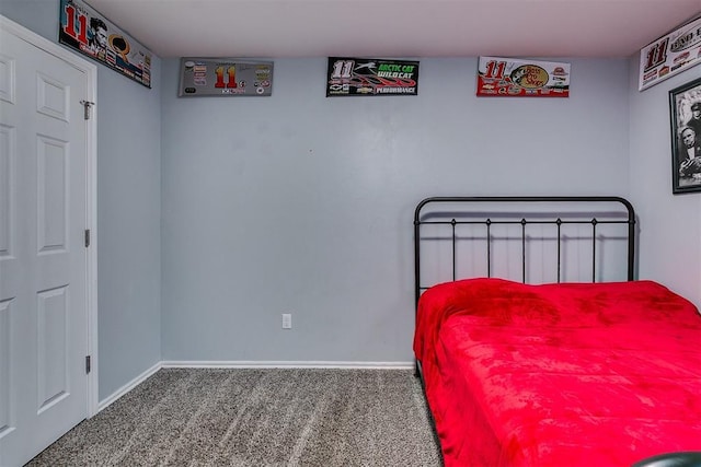 carpeted bedroom featuring baseboards